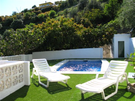 The swimming pool  of the land house is not visible from outside